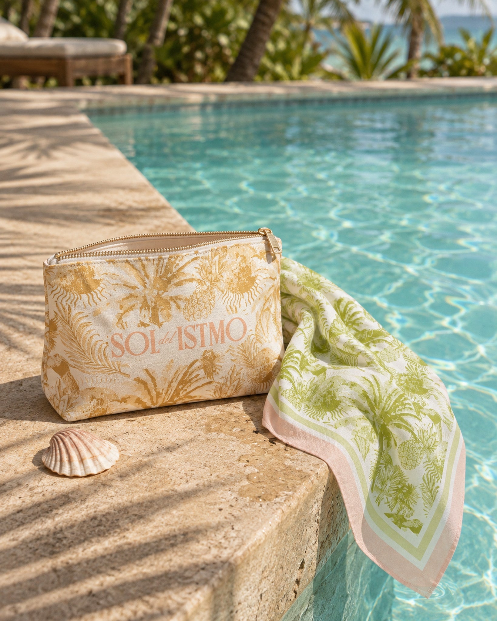 Sol del Istmo palm-print canvas pouch and bandana at the edge of a tropical pool in Panama
