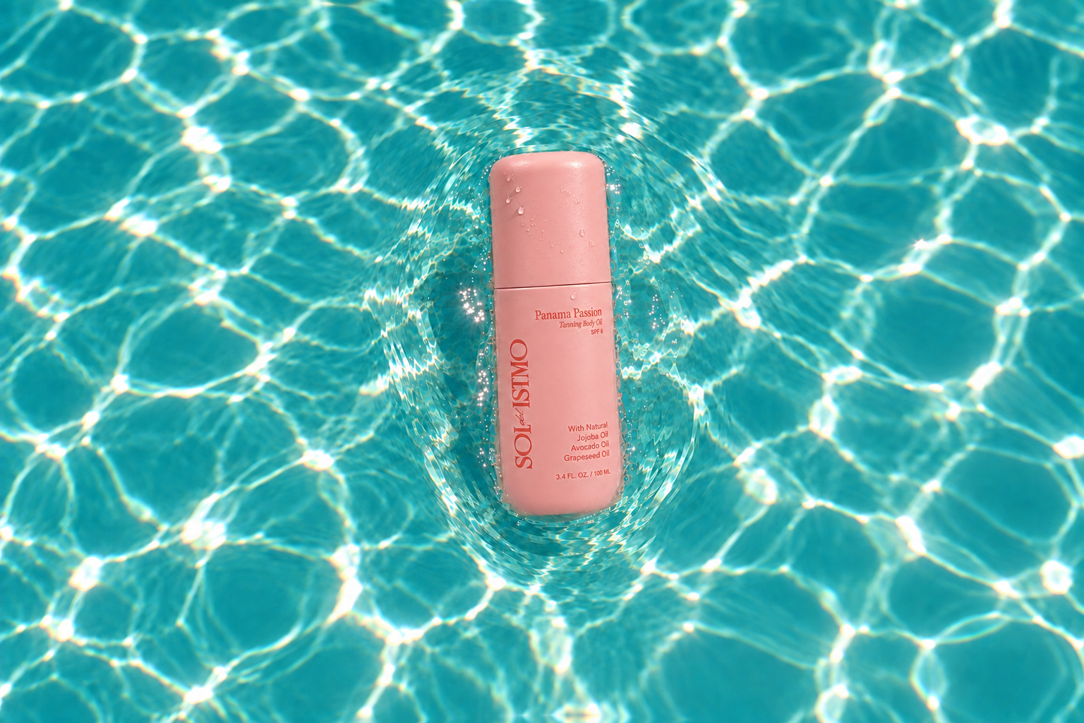 Panama Passion Tanning Body Oil floating in a turquoise pool